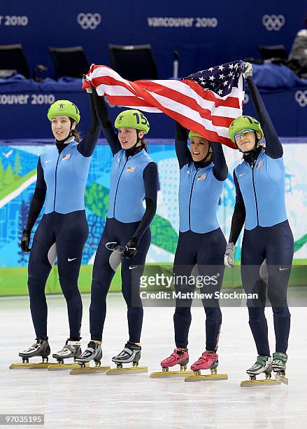 Lana Gehring, Alyson Dudek, Allison Baver and Katherine Reutter of the United States celebrate winning the bronze medal during the Short Track Speed...