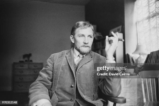 British actor Roy Dotrice smoking a cigar, UK, 18th January 1967.