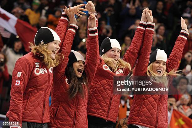 Canada's silver medalists Jessica Gregg, Kalyna Roberge, Marianne St. Gelais and Tania Vicent celebrate in the flower ceremony of the Women's Short...