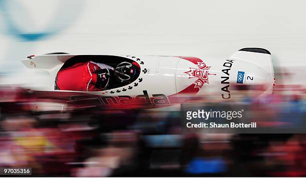 Kaillie Humphries and Heather Moyse of Canada in Canada 1 compete their fourth run during the womens bobsleigh on day 13 of the 2010 Vancouver Winter...