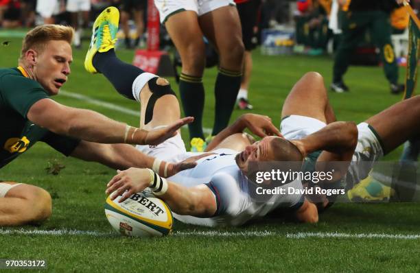 Mike Brown of England scores their first try during the first test between and South Africa and England at Ellis Park on June 9, 2018 in...