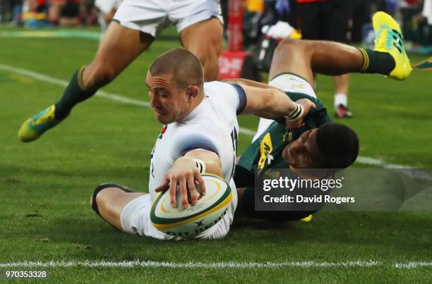 Mike Brown of England scores their first try during the first test between and South Africa and England at Ellis Park on June 9, 2018 in...