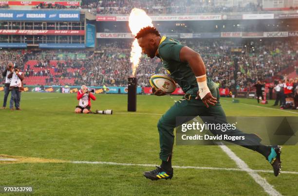 Siya Kolisi of South Africa leads out his team prior to the first test between and South Africa and England at Ellis Park on June 9, 2018 in...