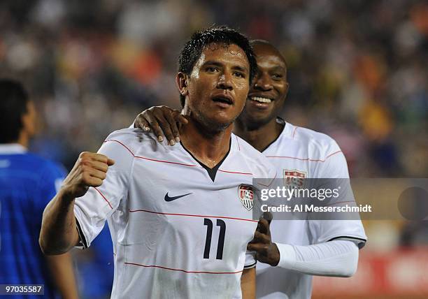 Forward Brian Ching of the U. S. Men's Soccer Team celebrates a game-tying goal with Jeff Cunningham against El Salvador February 24, 2010 at Raymond...