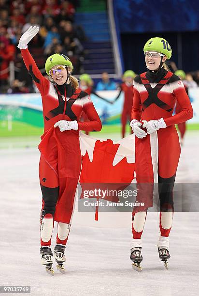 Marianne St-Gelais and Jessica Gregg of Canada celebrate winning the silver medal in the Short Track Speed Skating Ladies 3000m relay on day 13 of...