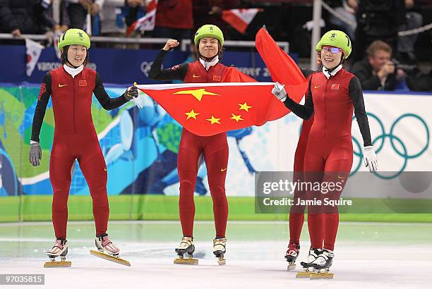 Sun Linlin, Wang Meng, Zhou Yang, Zhang Hui and Wang Meng of Team China celebrate winning the gold medal in the Short Track Speed Skating Ladies...