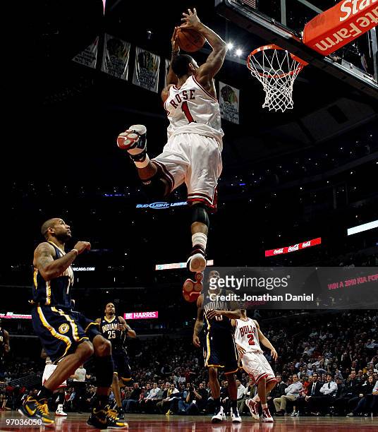 Derrick Rose of the Chicago Bulls takes a pass and leaps to dunk the ball against the Indiana Pacers at the United Center on February 24, 2010 in...