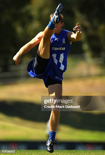 Drew Petrie of the Kangaroos kicks for goal during a North Melbourne Kangaroos AFL training session at Arden Street Ground on February 25, 2010 in...