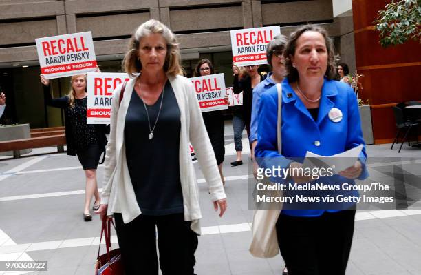 Katherine Spillar and Michele Dauber, left to right, deliver a notice of intent to recall Superior Court Judge Aaron Persky at the Santa Clara County...