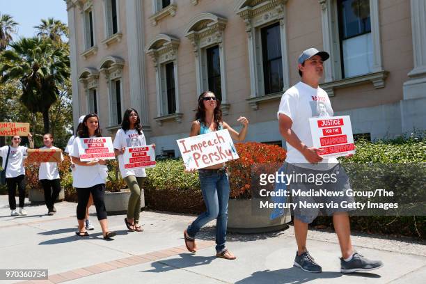 Protesters march next to the Old Courthouse demanding the impeachment of Santa Clara County Superior Court Judge Aaron Persky in San Jose, Calif., on...