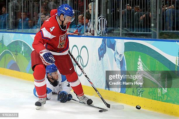 Zbynek Michalek of Czech Republic handles the puck against Saku Koivu of Finland during the ice hockey men's quarter final game between Finland and...