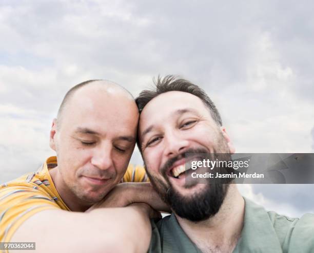 two happy men - jasmin merdan stock pictures, royalty-free photos & images