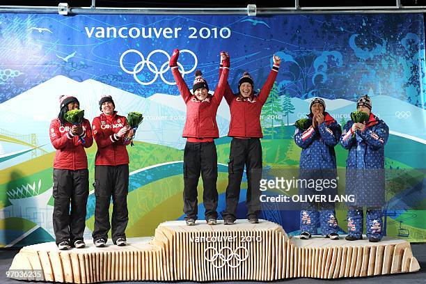 The Canada-1 women bobsleigh pilot Kaillie Humphries and brakeman Heather Moyse celebrate winning gold in the two-man bobsleigh event with Canada-2...