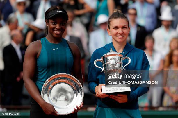 Romania's Simona Halep poses with the trophy, with second placed Sloane Stephens of the US , after winning the women's singles final match, on day...