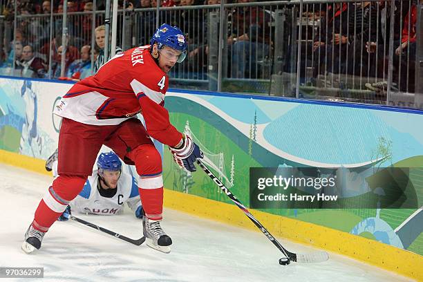 Zbynek Michalek of Czech Republic handles the puck against Saku Koivu of Finland during the ice hockey men's quarter final game between Finland and...