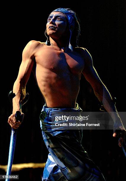 Dergin Tokmak performs on crutches onstage during photocall for Cirque du Soleil's 'Varekai' at The White Grand Chapiteau at The Trafford Centre on...