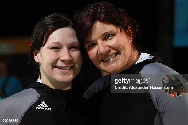 Sandra Kiriasis and Christin Senkel of Germany celebrate their fourth run during the women's bobsleigh on day 13 of the 2010 Vancouver Winter...