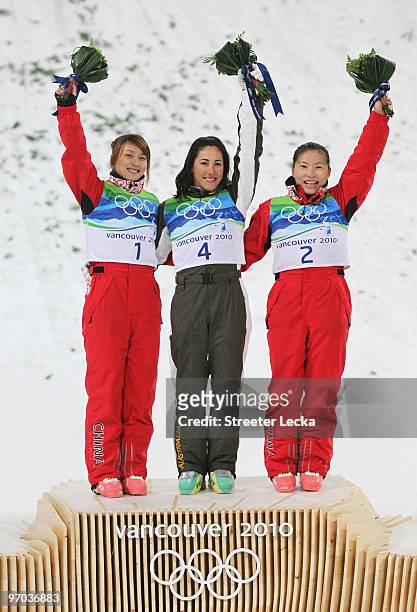 Li Nina of China celebrates winning silver, Lydia Lassila of Australia gold and Guo Xinxin of China bronze during the flower ceremony for the...