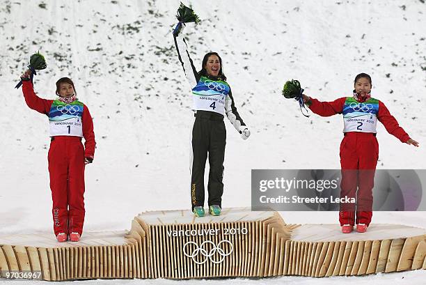 Li Nina of China celebrates winning silver, Lydia Lassila of Australia gold and Guo Xinxin of China bronze during the flower ceremony for the...