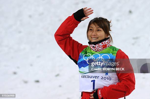 Li Nina of China reacts on the podium after the Freestyle Skiing women's aerial finals at Cypress Mountain, north of Vancouver during the Vancouver...