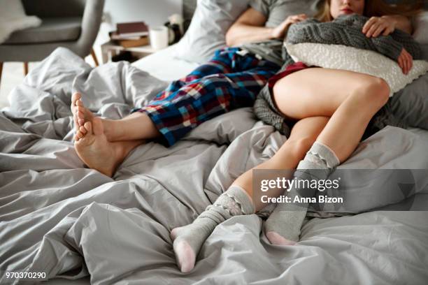 unrecognizable couple sleeping in bedroom. debica, poland - lazy poland fotografías e imágenes de stock