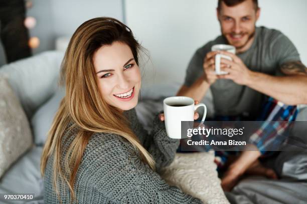 heterosexual couple with coffee in bed. debica, poland - lazy poland fotografías e imágenes de stock