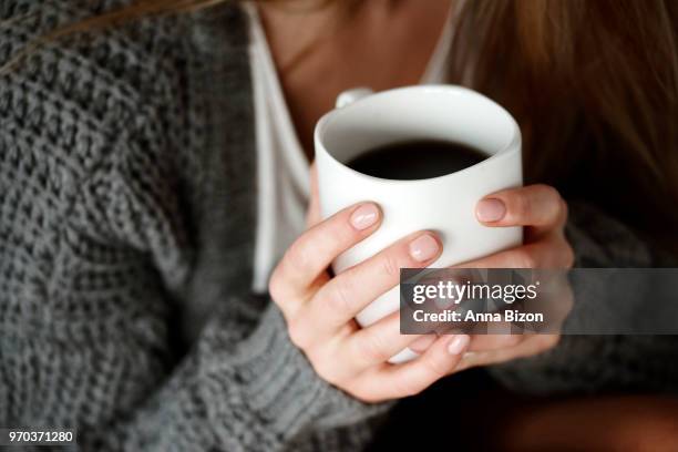 human hand holding coffee mug. debica, poland - lazy poland fotografías e imágenes de stock