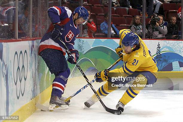 Peter Forsberg of Sweden battles for the puck during the ice hockey men's quarter final game between Sweden and Slovakia on day 13 of the Vancouver...