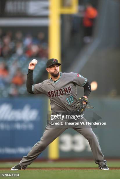 Deven Marrero of the Arizona Diamondbacks throws to first base to throw out Gorkys Hernandez of the San Francisco Giants in the bottom of the first...