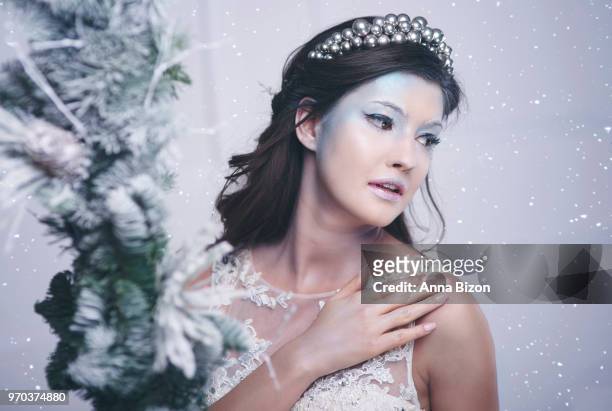 portrait shot of model as ice queen with christmas dcor out of focus. debica, poland - frozen princess stock pictures, royalty-free photos & images