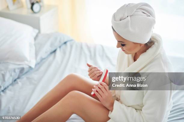 woman filing nails in the morning. debica, poland - anna bizon stock pictures, royalty-free photos & images