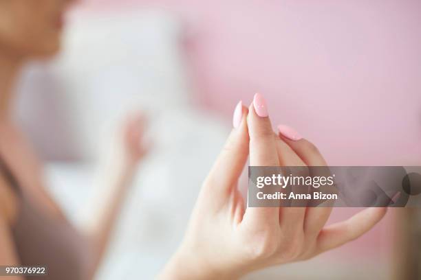 woman in lotus position practicing yoga. debica, poland - anna bizon foto e immagini stock