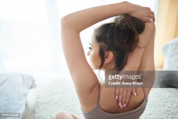 young woman stretching in the morning time. debica, poland - anna bizon stock pictures, royalty-free photos & images