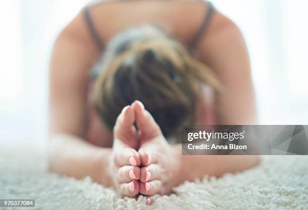 woman stretching in yoga pose. debica, poland - anna bizon stock pictures, royalty-free photos & images