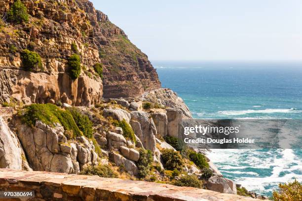 chapmans peak is a beautiful drive on a sunny day, with endless views and many viewing points. cape town, south africa. - chapmans peak stock pictures, royalty-free photos & images