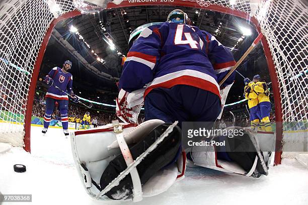 Peter Forsberg of Sweden celebrates with his team mates after he scored past goalkeeper Jaroslav Halak of Slovakia during the ice hockey men's...