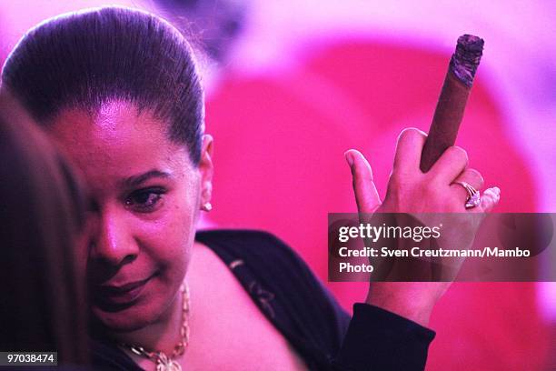 Woman smokes a Cuban cigar on February 24 in Havana, Cuba. In response to cigar sales lagging, Cuba is trying to interest women smokers in "the...