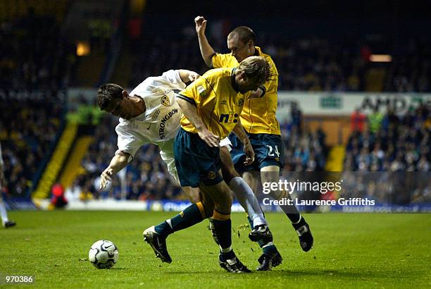 Johan Mjallby and Colin Healy of Celtic tackle Eirik Bakke of Leeds United during the Gary Kelly Testimonial match played at Elland Road, in Leeds,...