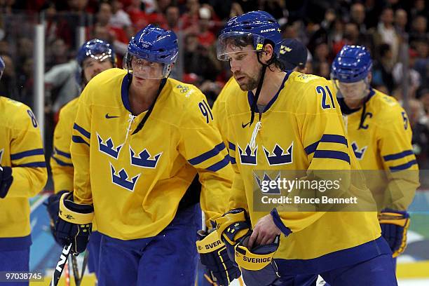 Loui Eriksson and Peter Forsberg of Sweden reacts after losing to Slovakia 4-3 in the quarterfinal game between Sweden and Slovakia on day 13 of the...