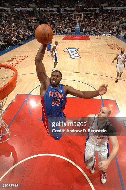 Jason Maxiell of the Detroit Pistons rises for a dunk against Chris Kaman of the Los Angeles Clippers at Staples Center on February 24, 2010 in Los...