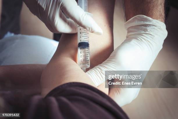 doctor vaccinating patient in clinic - steroids stock pictures, royalty-free photos & images