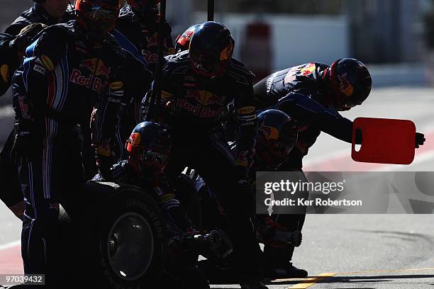 Red Bull Racing mechanics at work during a filming day prior to Formula One winter testing at the Circuit De Catalunya on February 24, 2010 in...