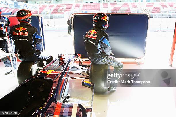 Red Bull Racing mechanics at work during a filming day prior to Formula One winter testing at the Circuit De Catalunya on February 24, 2010 in...