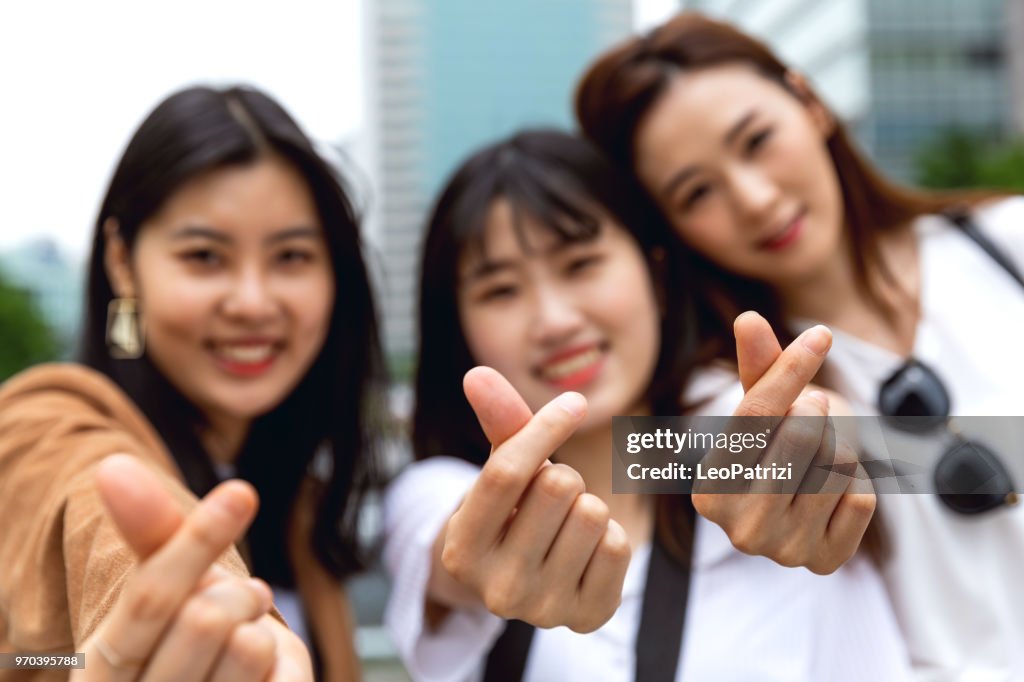 Great friends - Women in Seoul - South Korea making heart shape gesture