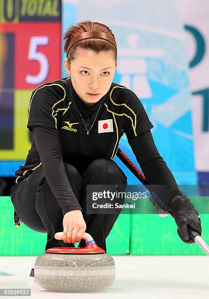 Kotomi Ishizaki competes during the women's curling round robin game between Japan and Sweden on day 12 of the Vancouver 2010 Winter Olympics at...