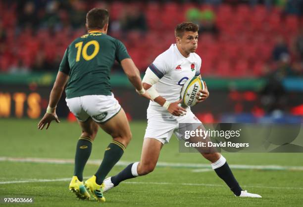 Henry Slade of England is faced by Handre Pollard of South Africa during the first test between and South Africa and England at Ellis Park on June 9,...