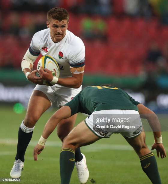 Henry Slade of England is faced by Handre Pollard of South Africa during the first test between and South Africa and England at Ellis Park on June 9,...