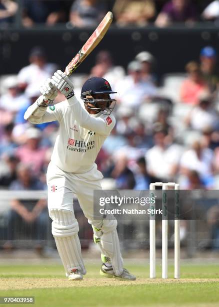 Shivnarine Chanderpaul plays the cover drive shot during the Specsavers Championship Division One match between Lancashire and Essex at Old Trafford...