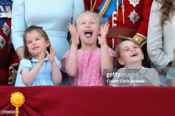 Princess Charlotte of Cambridge, Savannah Phillips, Prince George of Cambridge watch the flypast on the balcony of Buckingham Palace during Trooping...