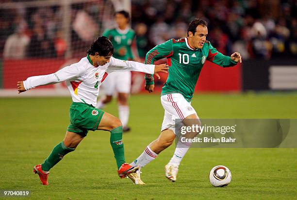 Cuauhtemoc Blanco of Mexico heads for the goal against Marvin Bejarano of Bolivia in the first half of a friendly match at Candlestick Park in...